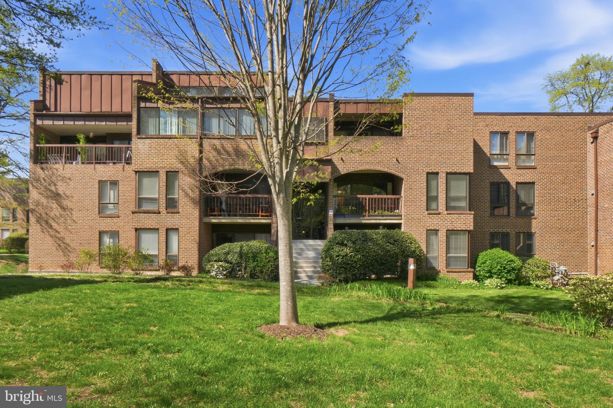 11228 Chestnut Grove Square, Unit 132 Reston, VA 20190 - Photo 2 of 25 Charming brick apartment with greenery.