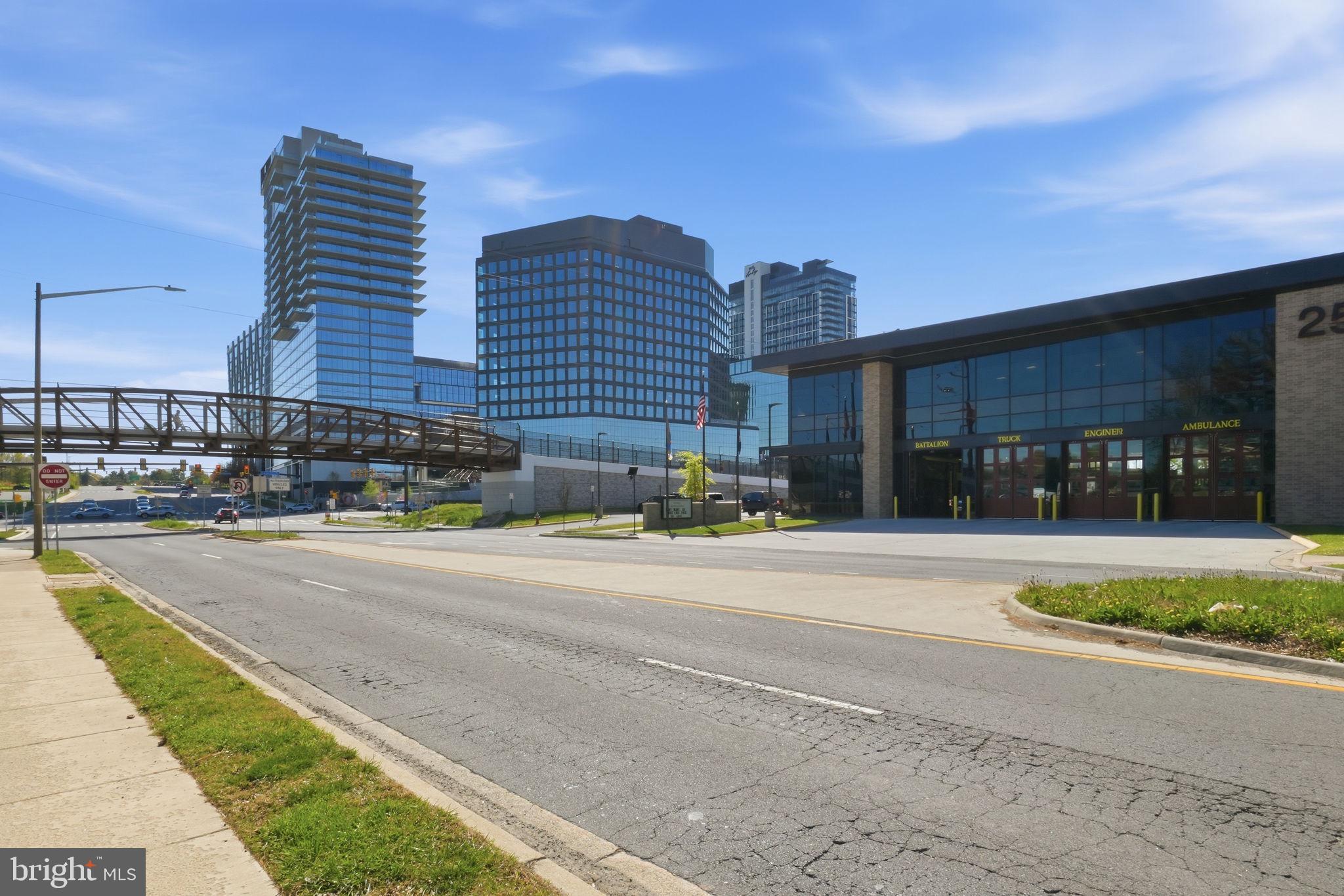11228 Chestnut Grove Square, Unit 132 Reston, VA 20190 - Photo 22 of 25 Modern skyline meets urban pathway.