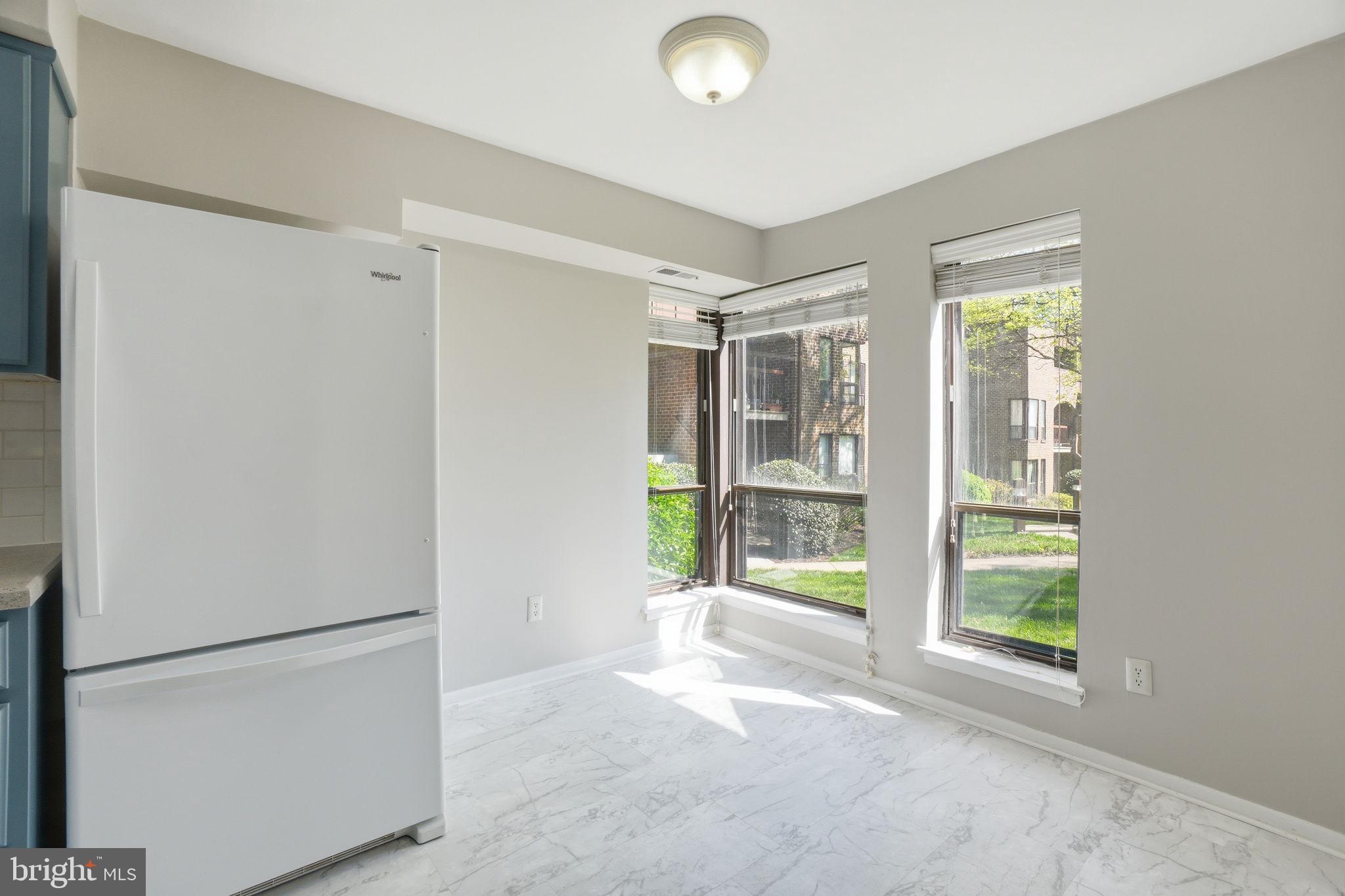 11228 Chestnut Grove Square, Unit 132 Reston, VA 20190 - Photo 6 of 25 Bright and airy kitchen retreat.