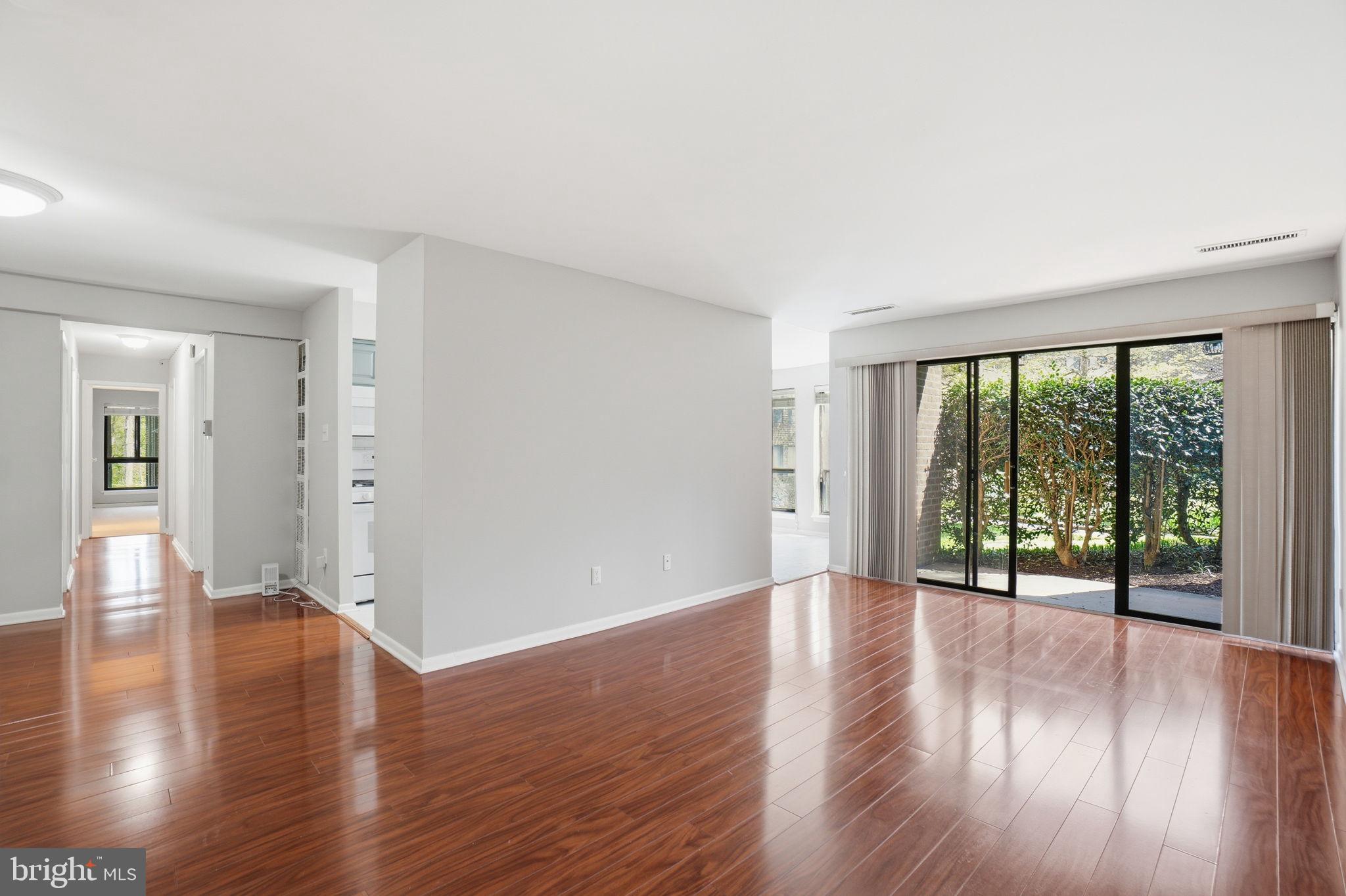 11228 Chestnut Grove Square, Unit 132 Reston, VA 20190 - Photo 7 of 25 Bright and airy open living space.