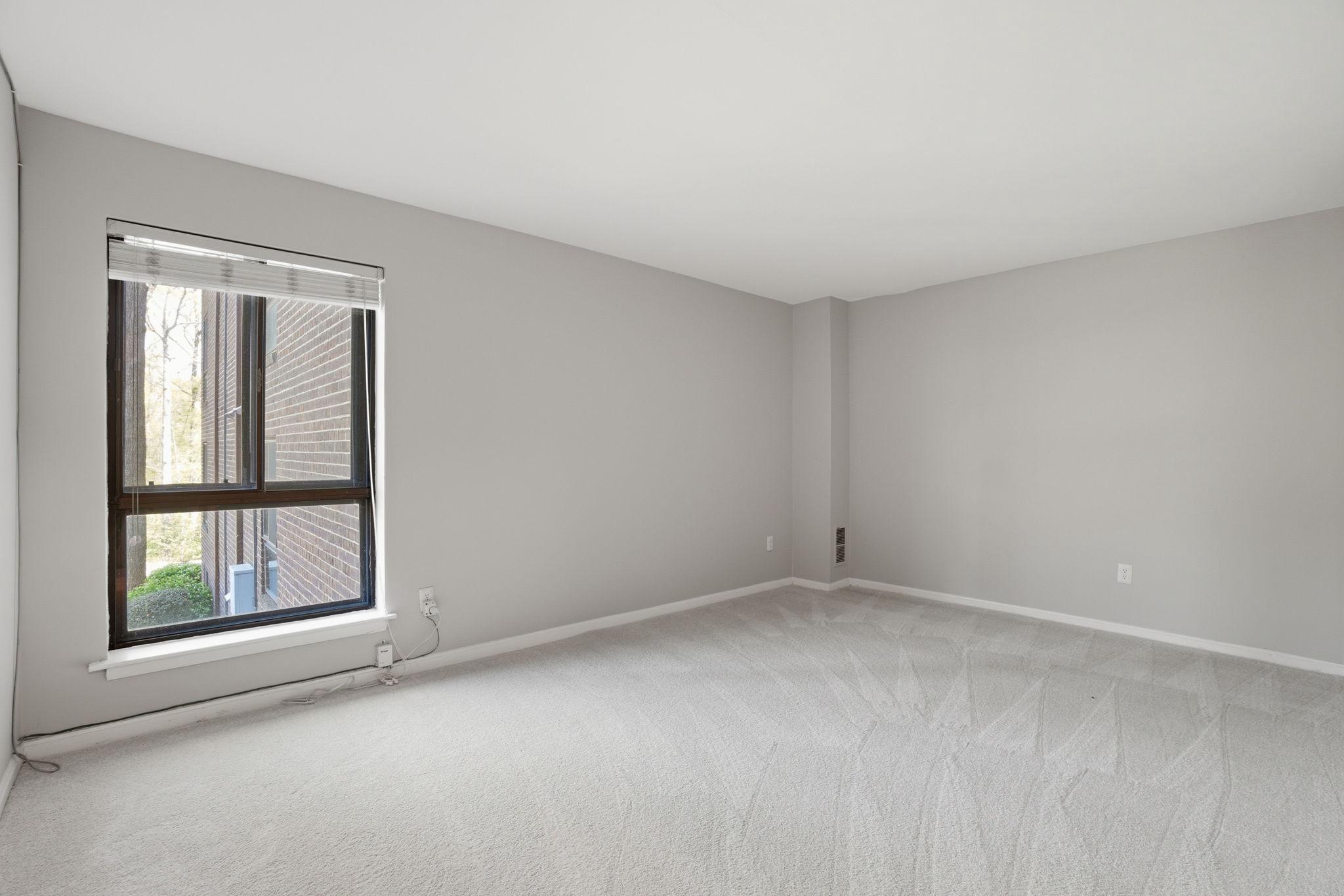 11228 Chestnut Grove Square, Unit 132 Reston, VA 20190 - Photo 9 of 25 Large primary bedroom with a walk-in closet