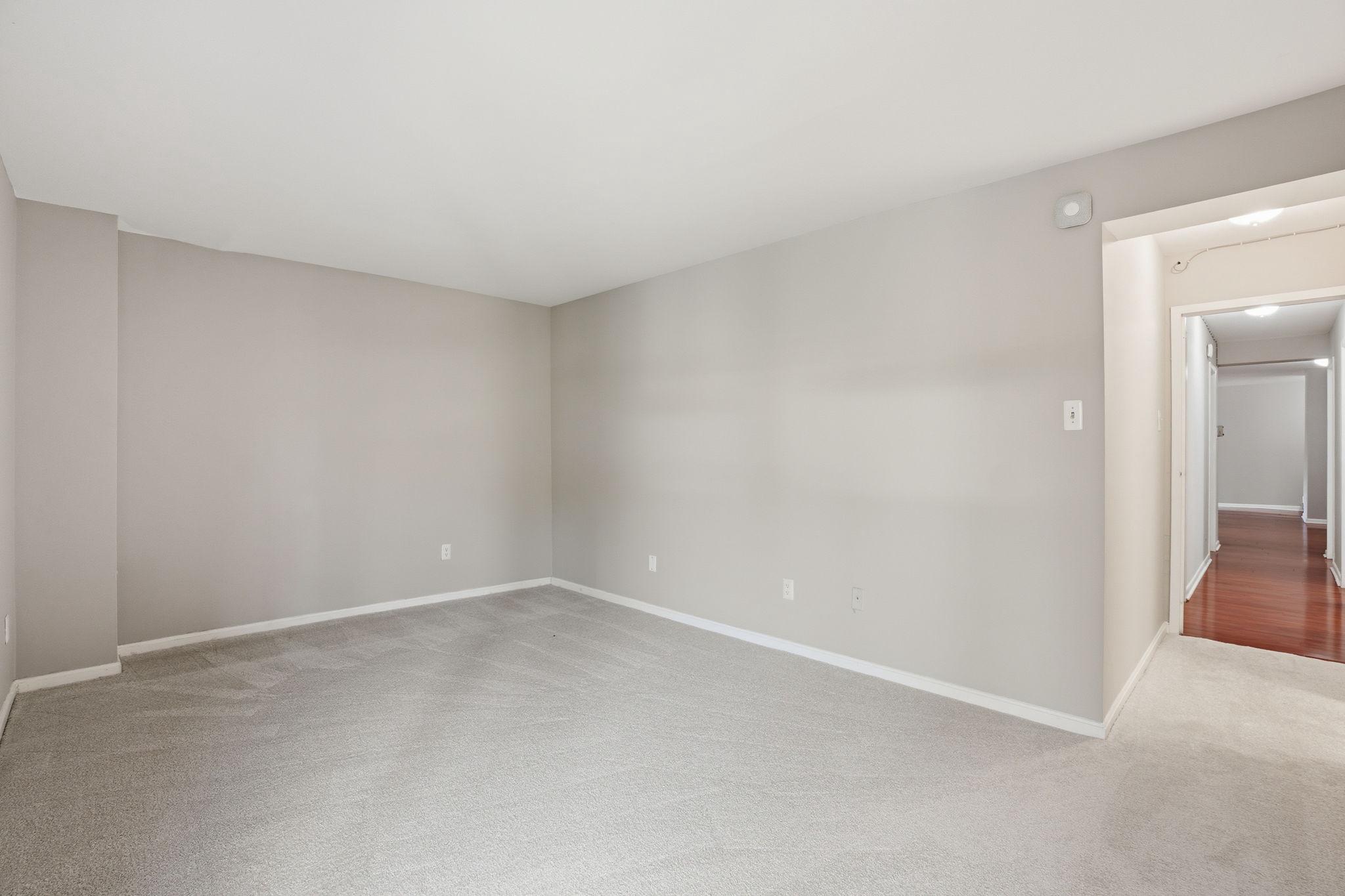 11228 Chestnut Grove Square, Unit 132 Reston, VA 20190 - Photo 10 of 25 Large primary bedroom at the end of the hall