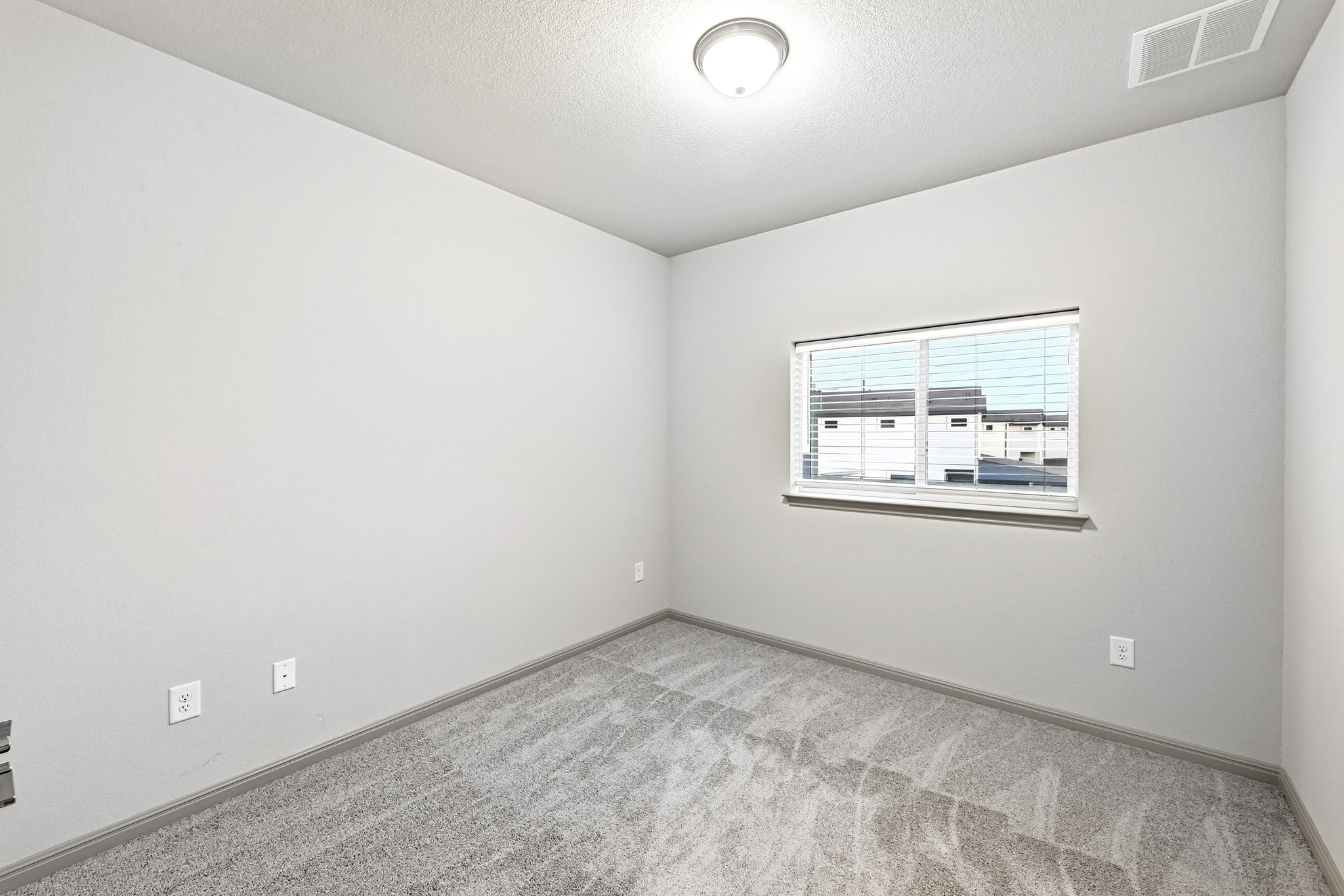 5517 Charles Merle Dr., Unit B Austin, TX 78747 - Photo 11 of 25 an empty room with a window