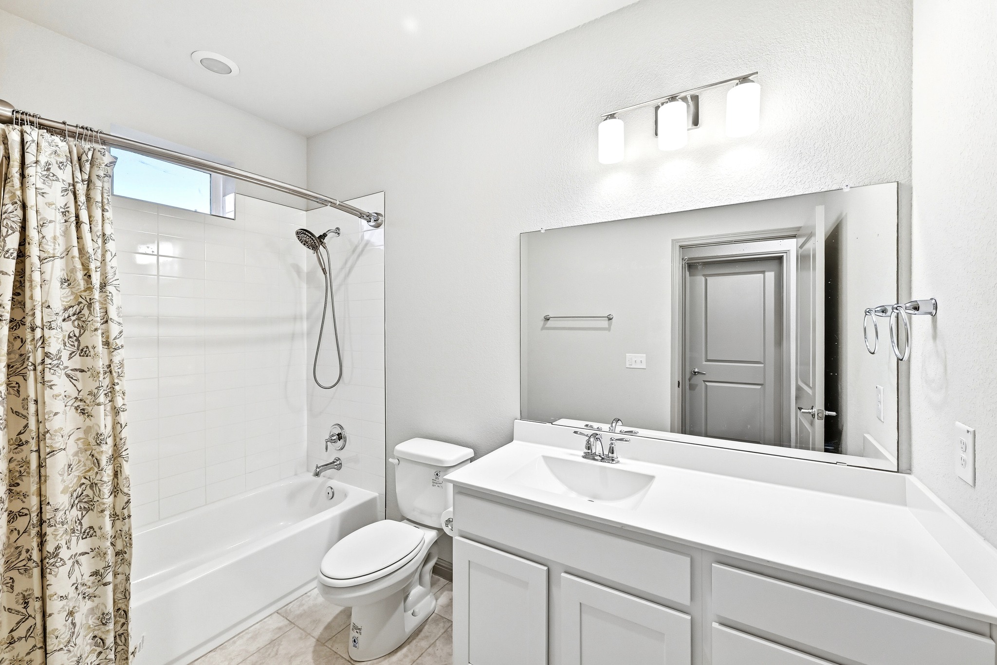 5517 Charles Merle Dr., Unit B Austin, TX 78747 - Photo 12 of 25 a bathroom with a sink toilet and shower