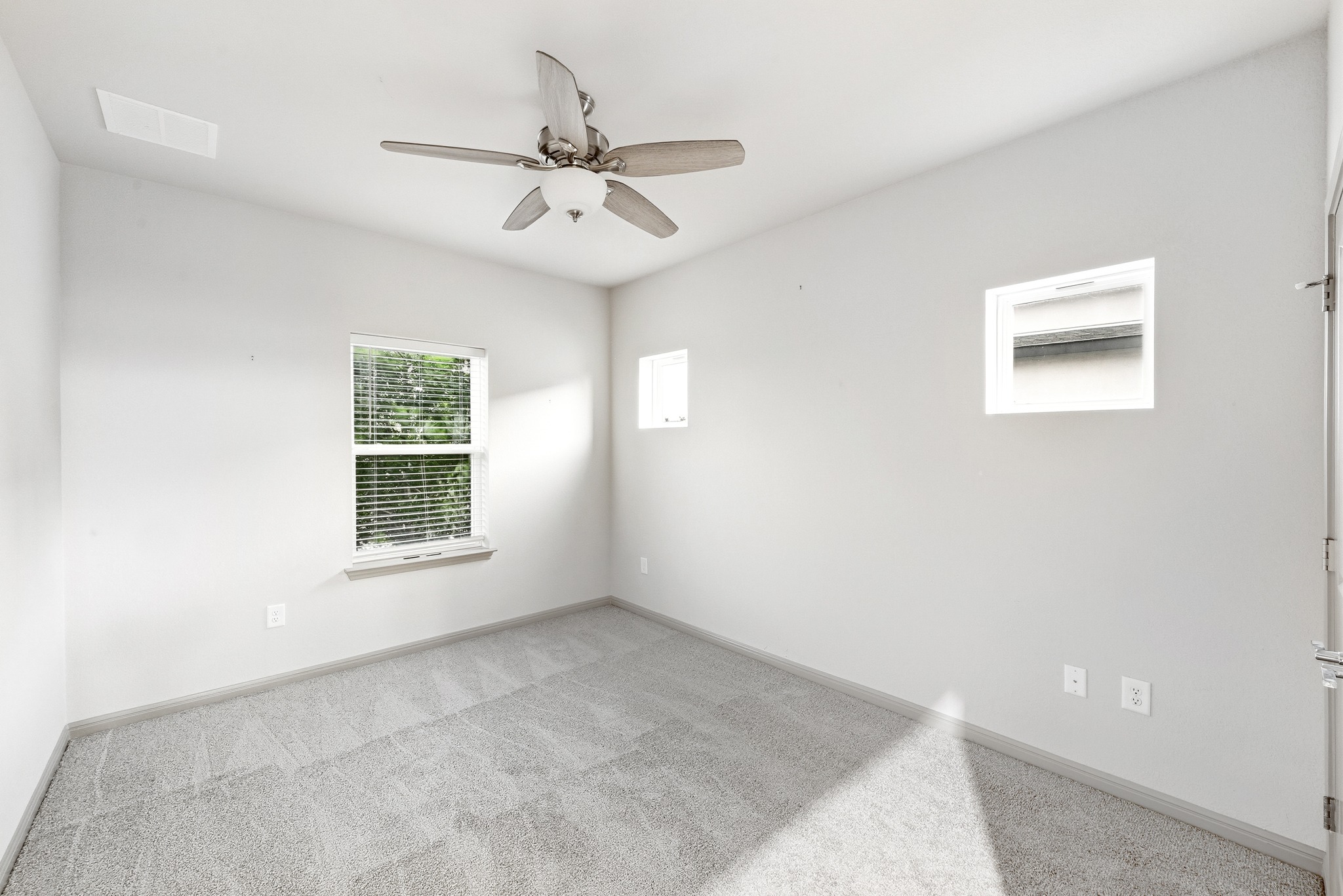 5517 Charles Merle Dr., Unit B Austin, TX 78747 - Photo 13 of 25 an empty room with a window