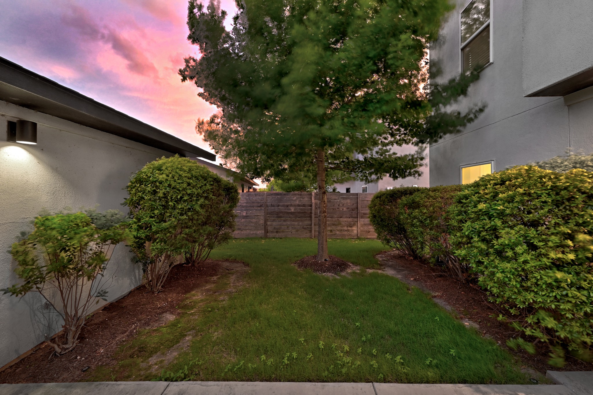 5517 Charles Merle Dr., Unit B Austin, TX 78747 - Photo 16 of 25 a backyard of a house with lots of green space