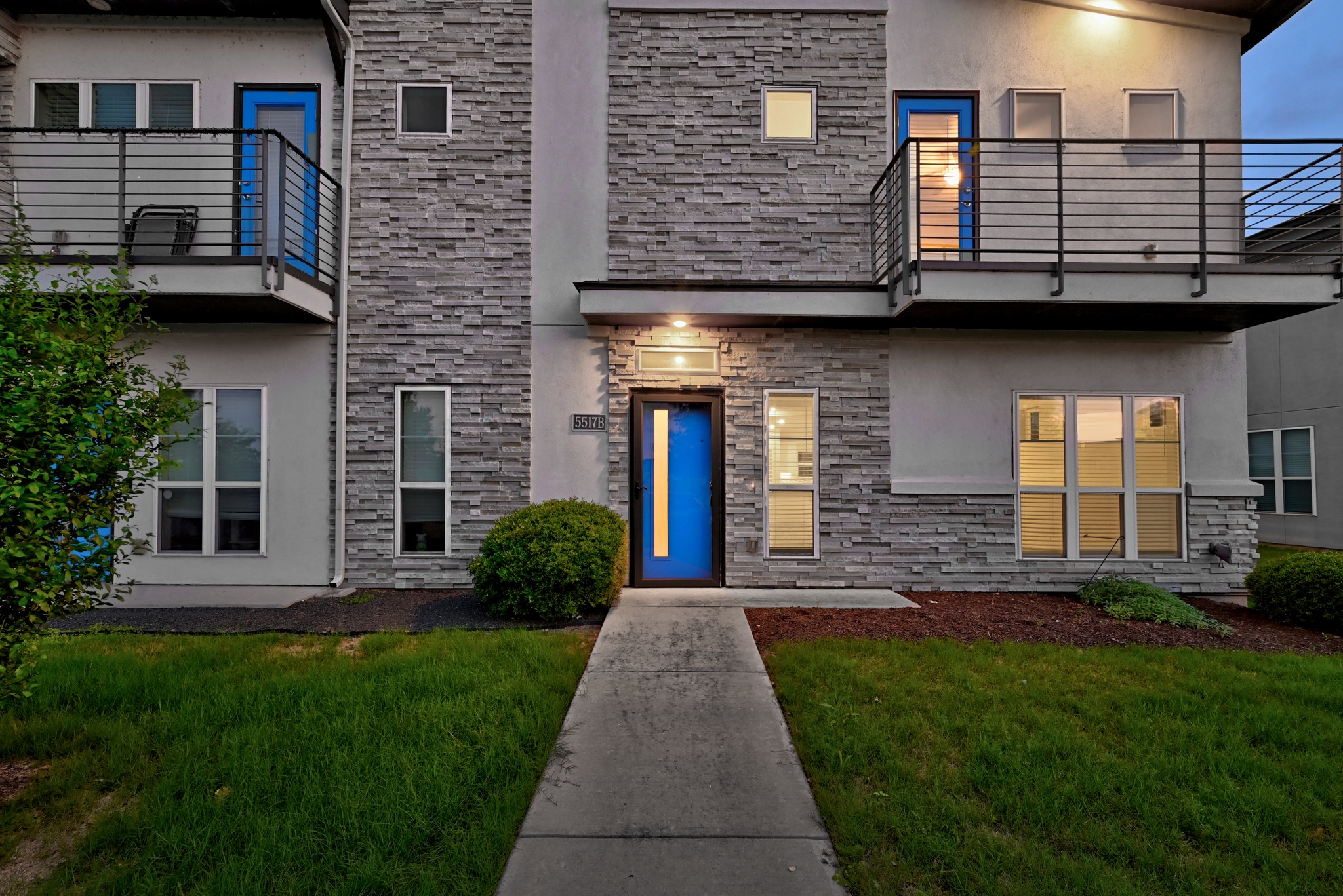 5517 Charles Merle Dr., Unit B Austin, TX 78747 - Photo 2 of 25 a front view of a house with garden
