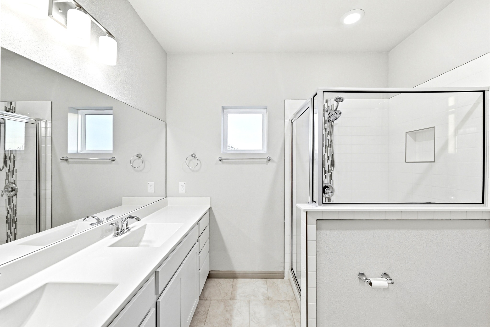 5517 Charles Merle Dr., Unit B Austin, TX 78747 - Photo 10 of 25 a bathroom with a sink a mirror and a bathtub