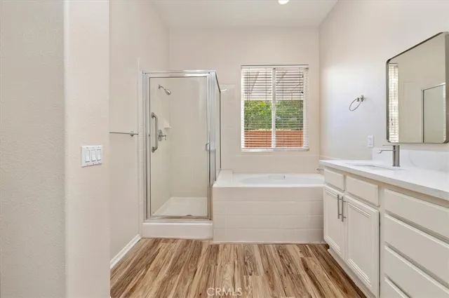 a bathroom with a sink a mirror and a bathtub
