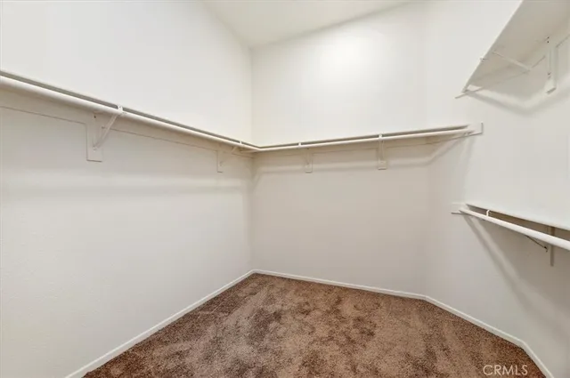 a view of a room with shelf on the wall