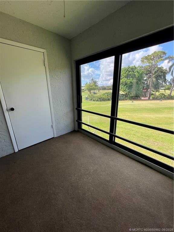 5335 Southeast Miles Grant Road, Unit 214 Stuart, FL 34997 - Photo 9 of 17 a view of room with window