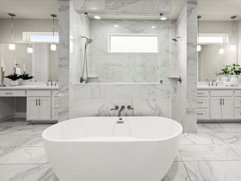 227 Bridge Water Loop Dripping Springs, TX 78620 - Photo 22 of 40 a white bath tub sitting in a bathroom and sink
