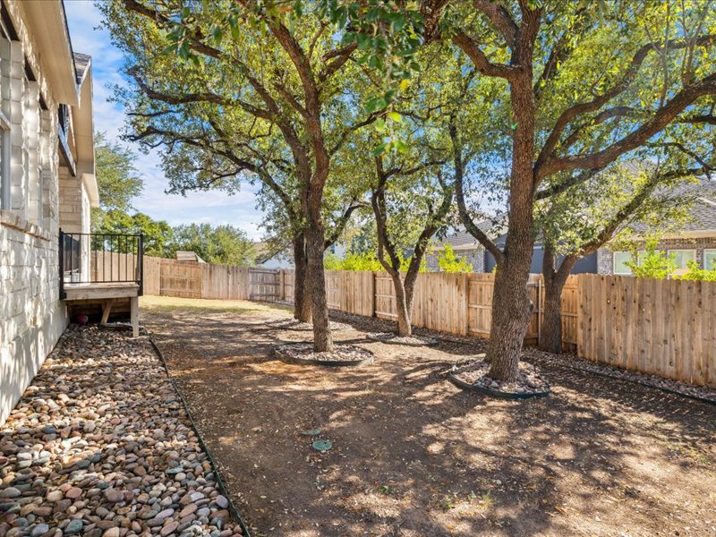 227 Bridge Water Loop Dripping Springs, TX 78620 - Photo 36 of 40 front view of a house with a tree in the background