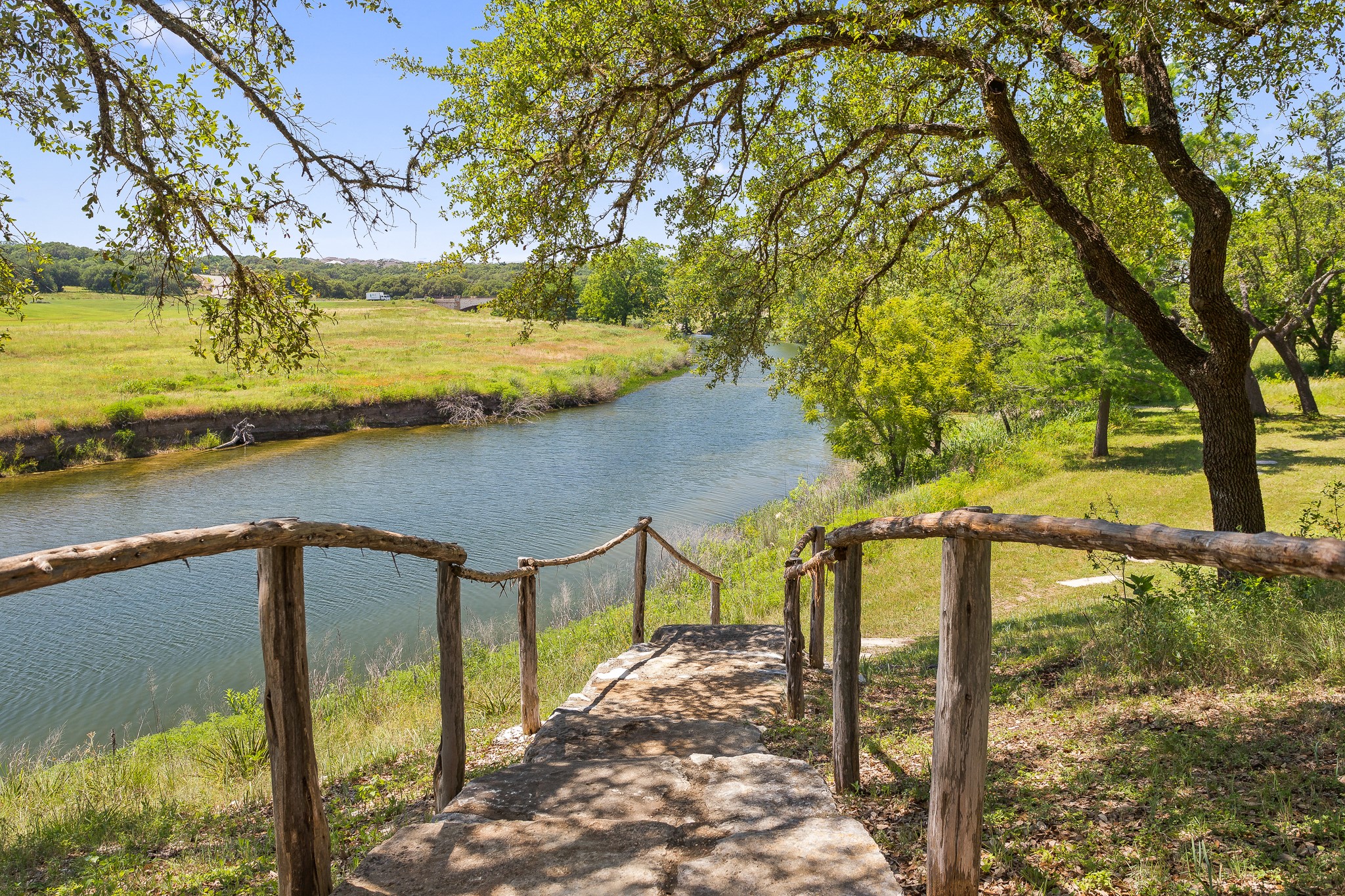 227 Bridge Water Loop Dripping Springs, TX 78620 - Photo 37 of 40 a view of a lake with a mountain view