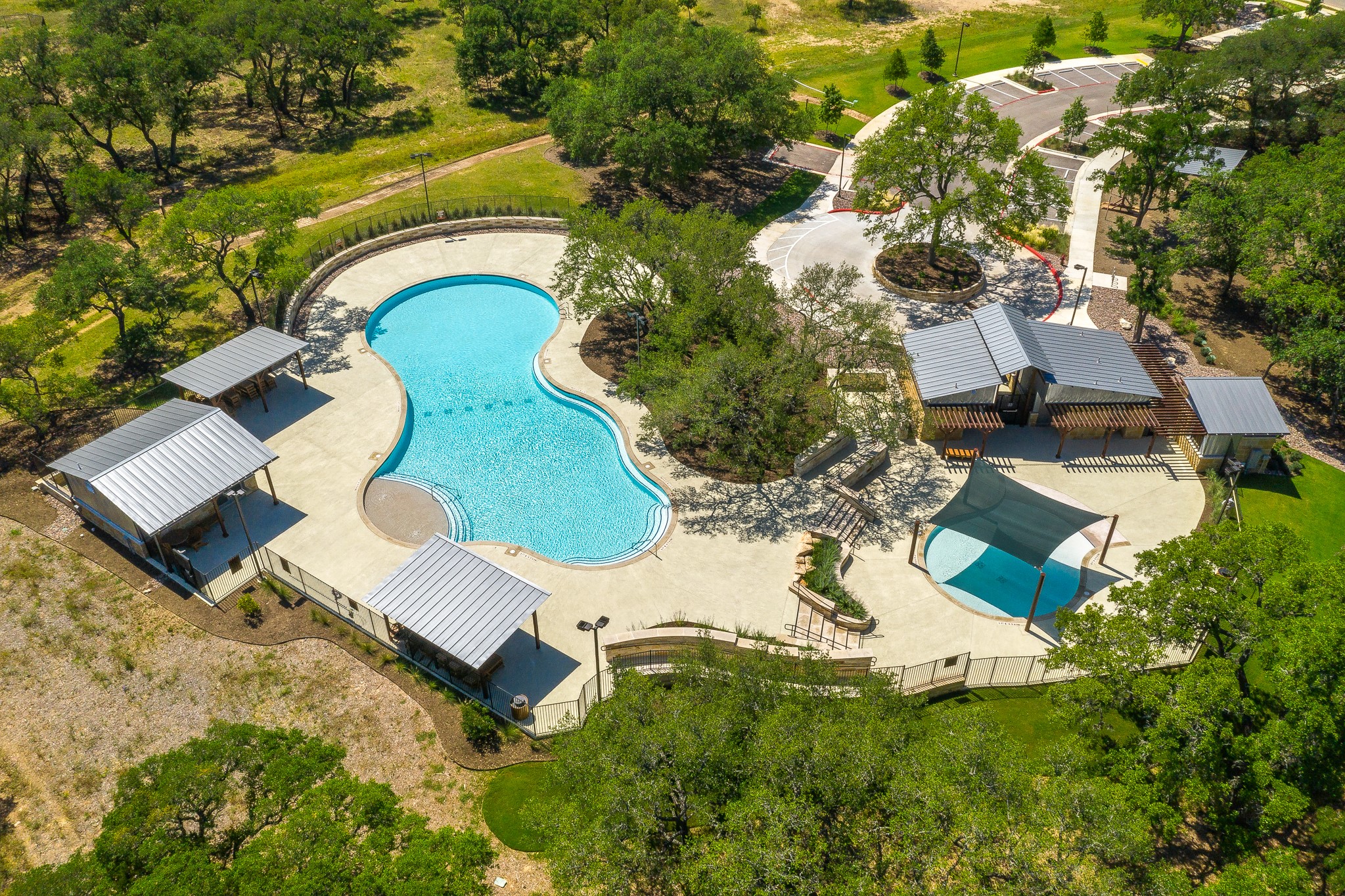 227 Bridge Water Loop Dripping Springs, TX 78620 - Photo 38 of 40 an aerial view of a house with swimming pool and outdoor space