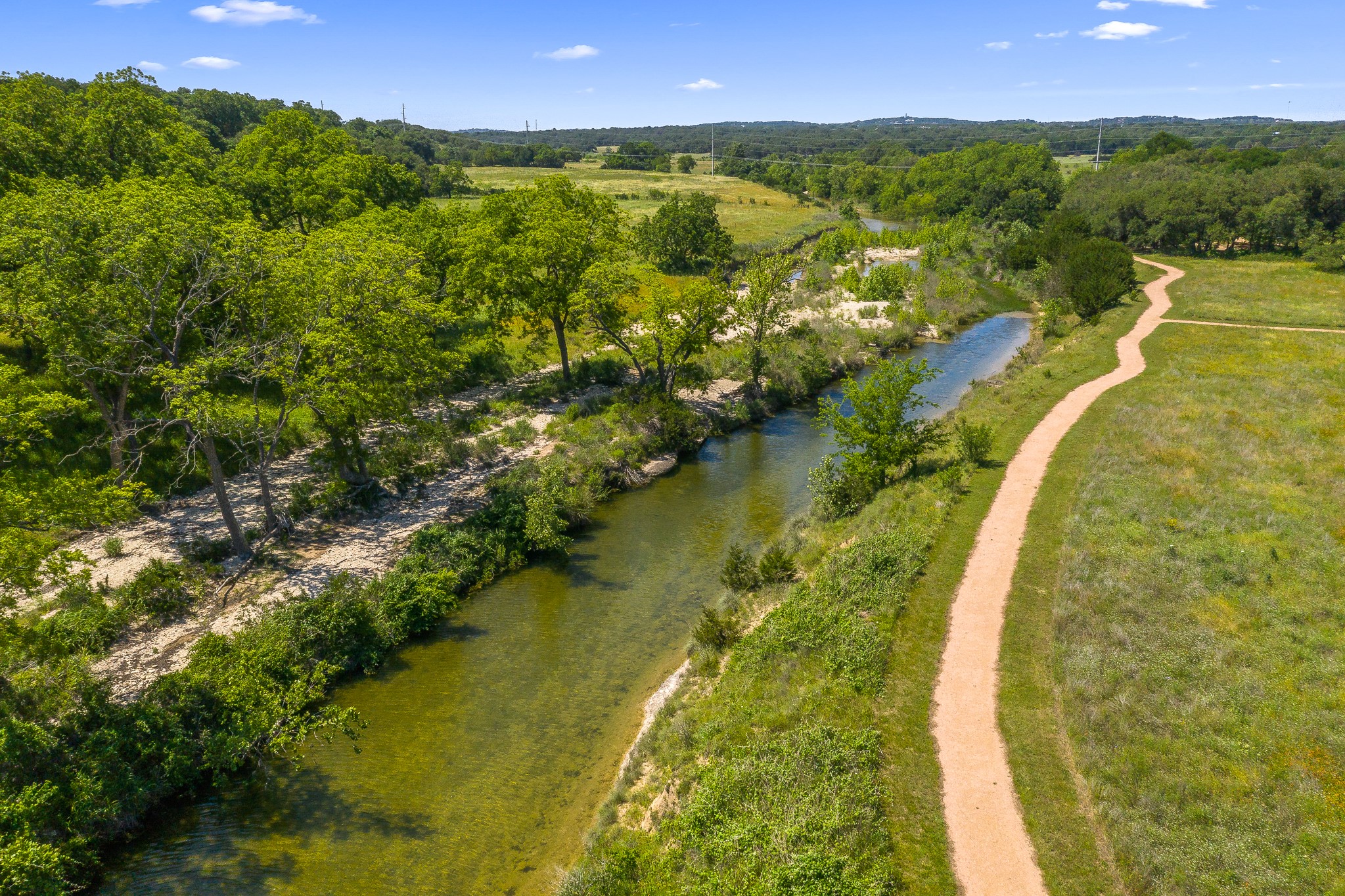 227 Bridge Water Loop Dripping Springs, TX 78620 - Photo 40 of 40 a view of a lake in middle of the town