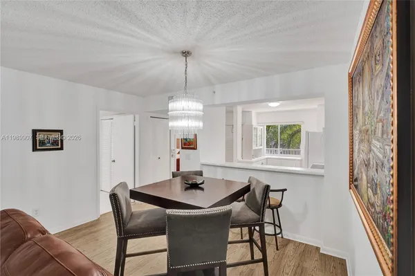 a view of a dining room with furniture and window