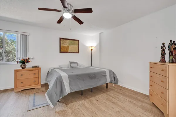 a living room with furniture and flowers