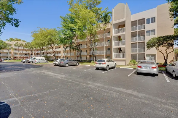 a view of cars parked in front of a building