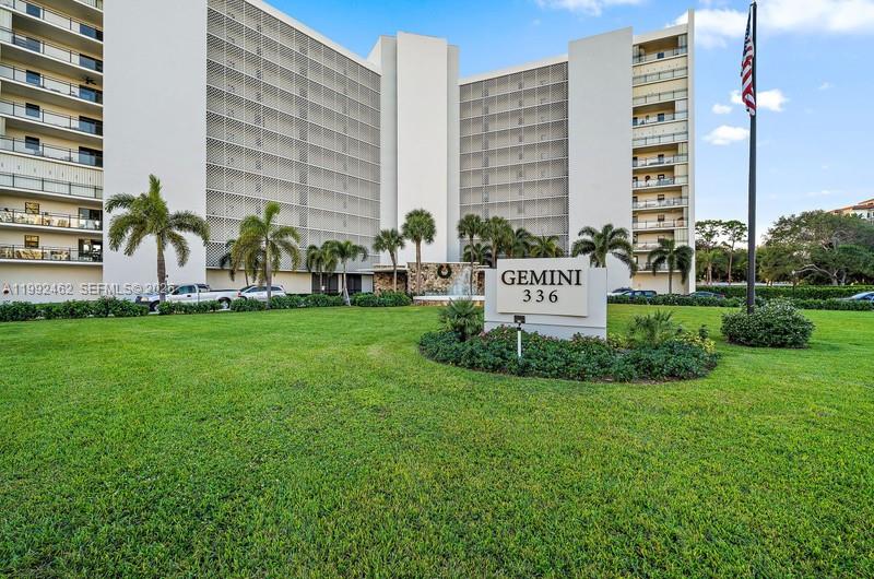 336 Golfview Road, Unit 311 North Palm Beach, FL 33408 - Photo 1 of 62 a view of building with garden and bench