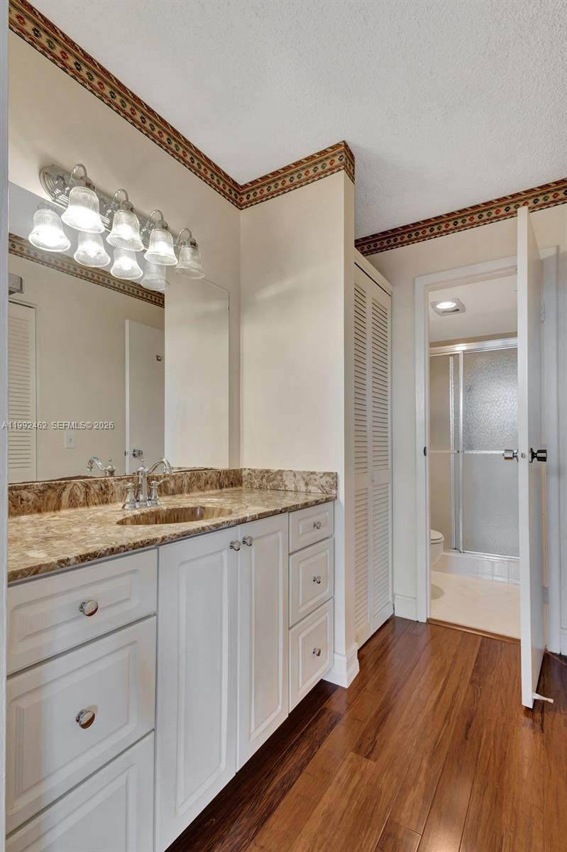 336 Golfview Road, Unit 311 North Palm Beach, FL 33408 - Photo 24 of 62 a bathroom with a granite countertop sink a mirror and shower