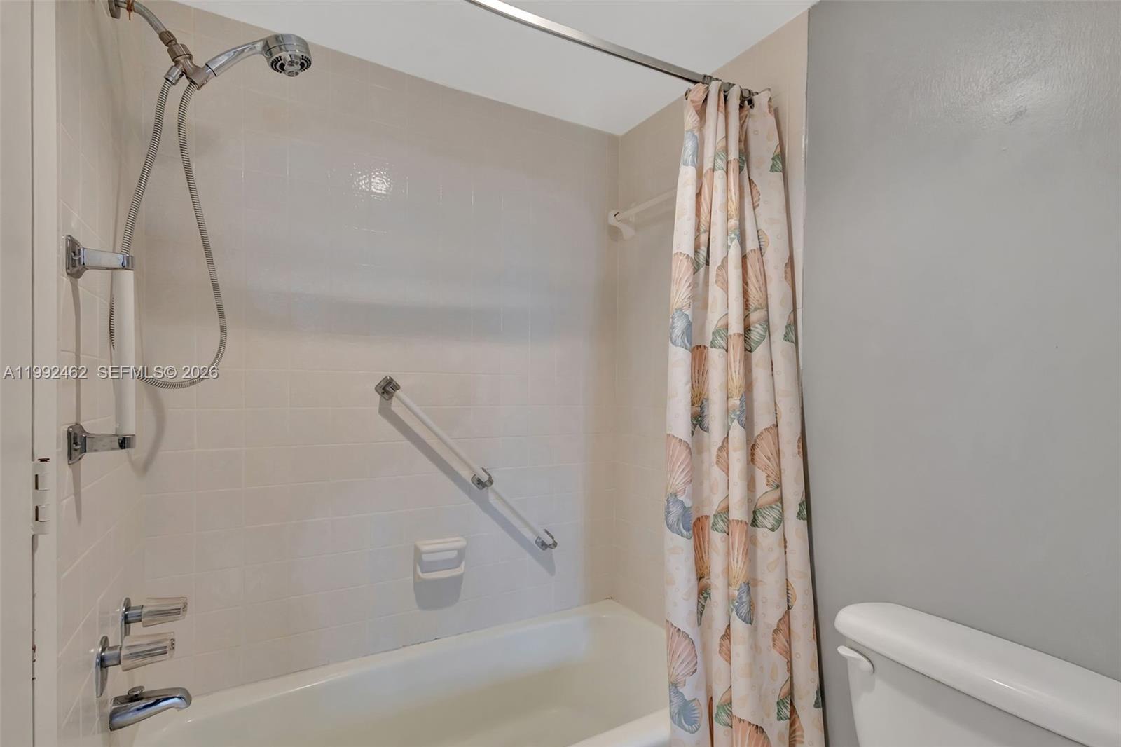 336 Golfview Road, Unit 311 North Palm Beach, FL 33408 - Photo 33 of 62 a bathroom with a shower and a toilet