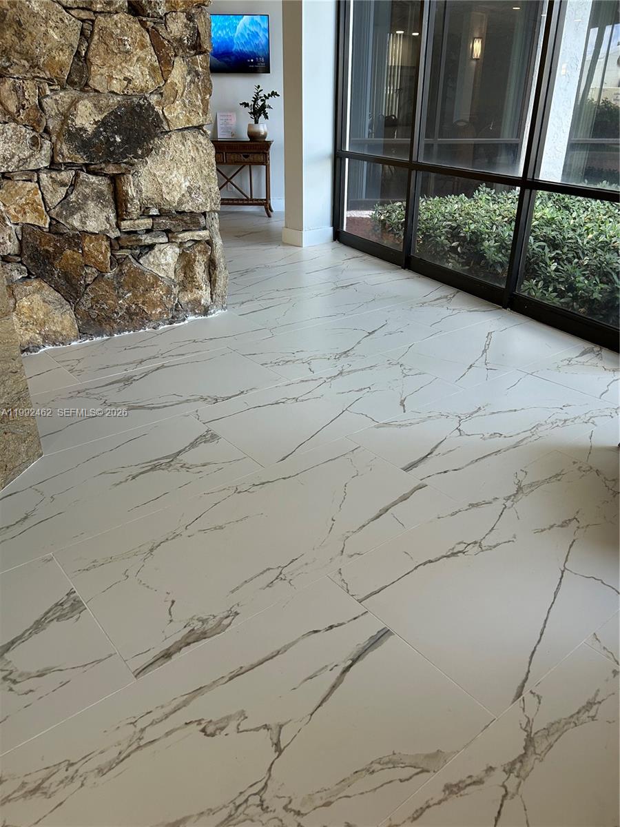 336 Golfview Road, Unit 311 North Palm Beach, FL 33408 - Photo 42 of 62 New Reception area and Lobby tile as of 4/2025