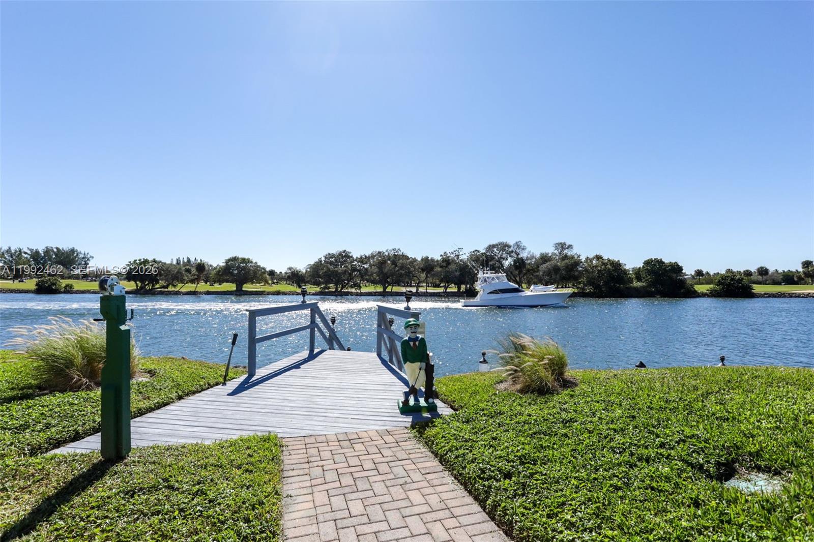 336 Golfview Road, Unit 311 North Palm Beach, FL 33408 - Photo 58 of 62 a view of a lake with houses in the back