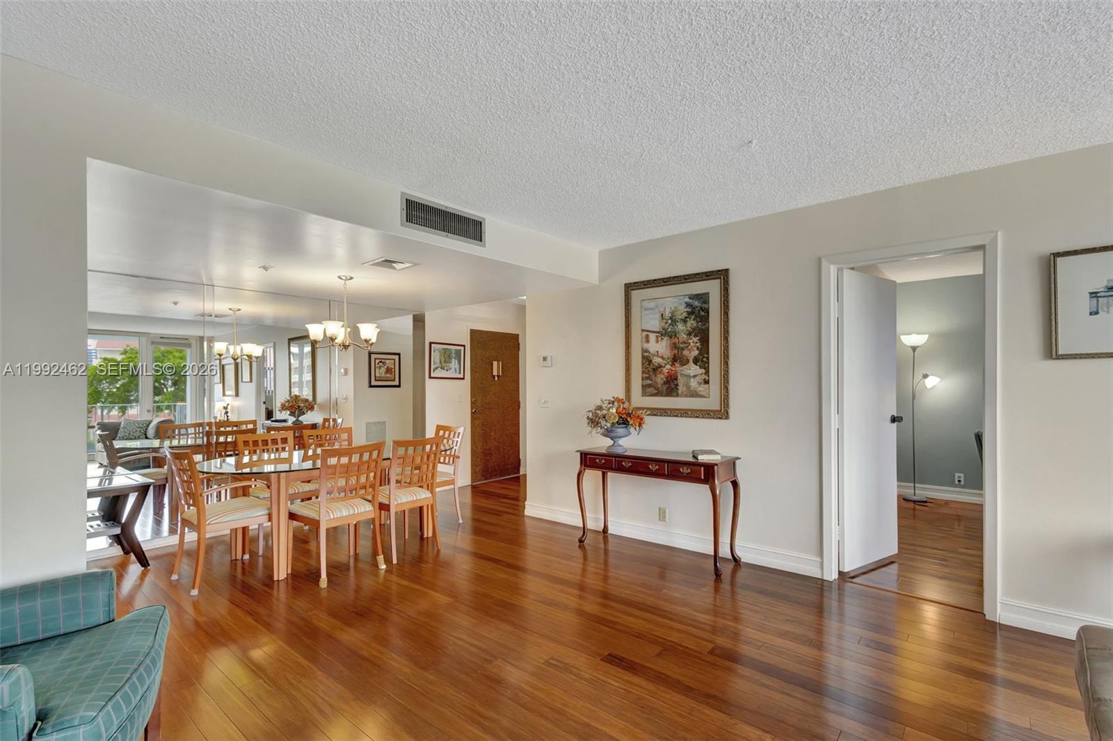 336 Golfview Road, Unit 311 North Palm Beach, FL 33408 - Photo 10 of 62 a view of a a dining room with furniture window and wooden floor