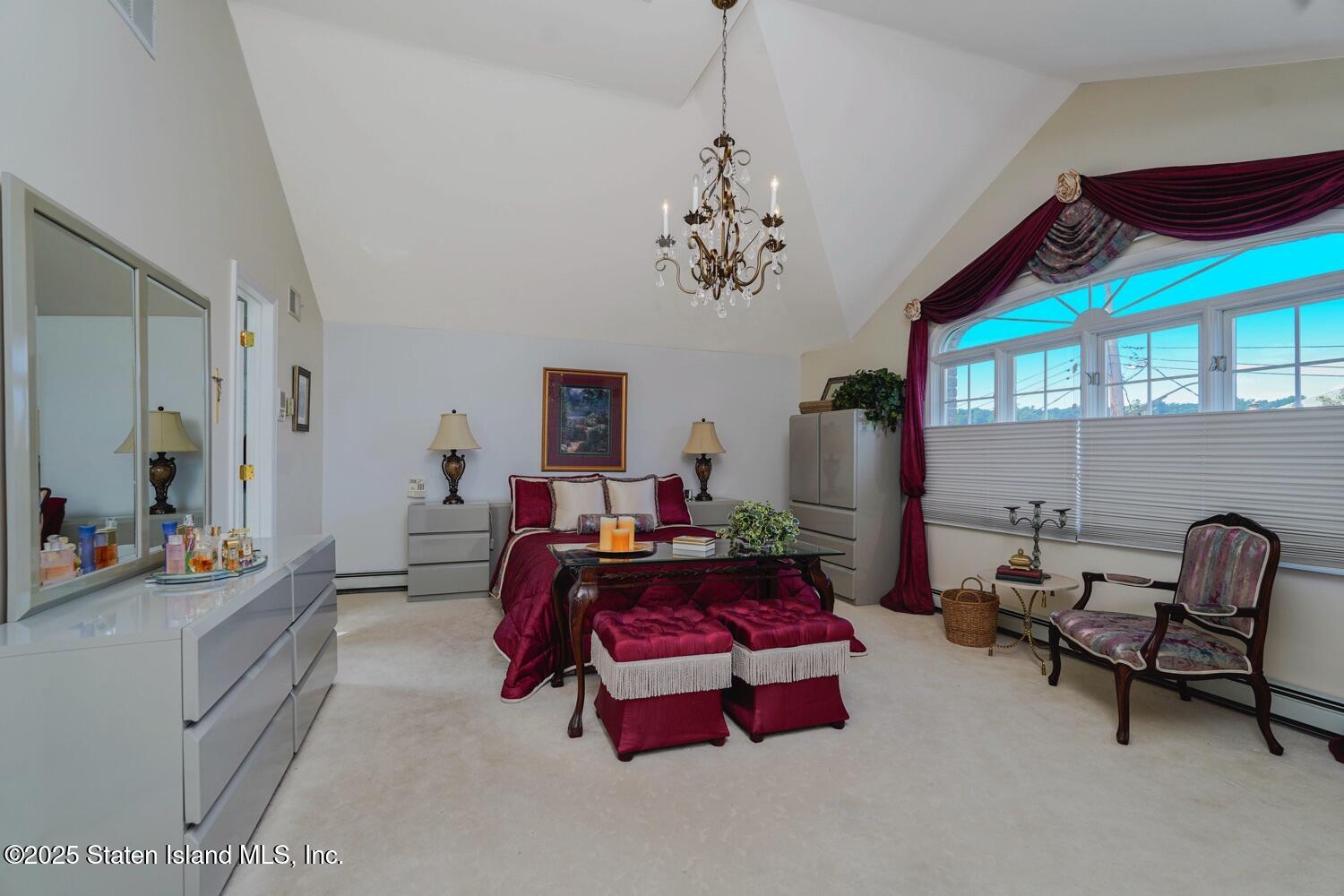 312 Barbara Street Staten Island, NY 10306 - Photo 14 of 34 a living room with furniture and a chandelier