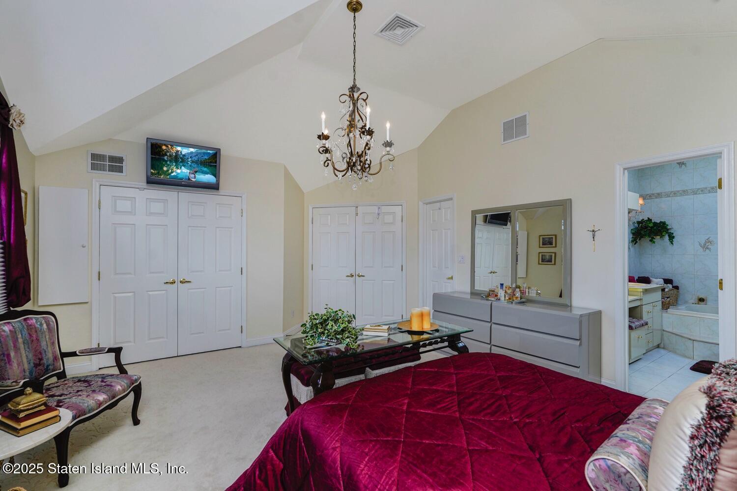 312 Barbara Street Staten Island, NY 10306 - Photo 15 of 34 a bedroom with a bed and furniture