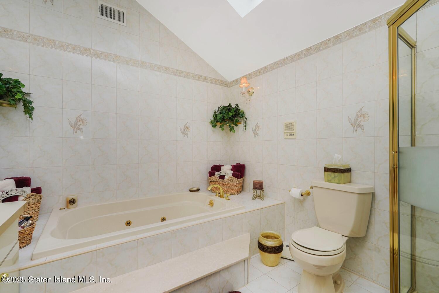 312 Barbara Street Staten Island, NY 10306 - Photo 17 of 34 a bathroom with a sink a toilet and a bathtub