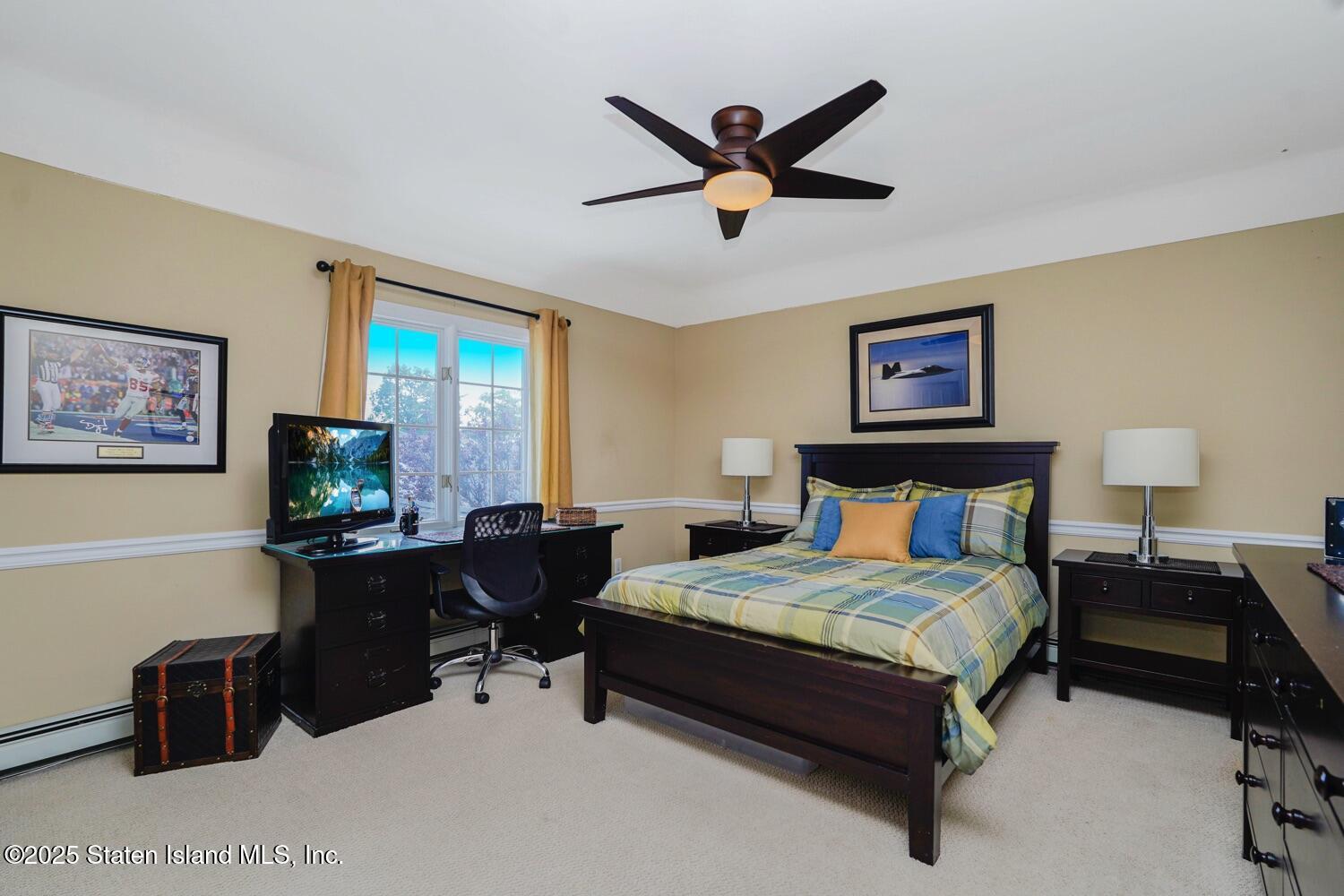 312 Barbara Street Staten Island, NY 10306 - Photo 18 of 34 a bedroom with a bed and a desk