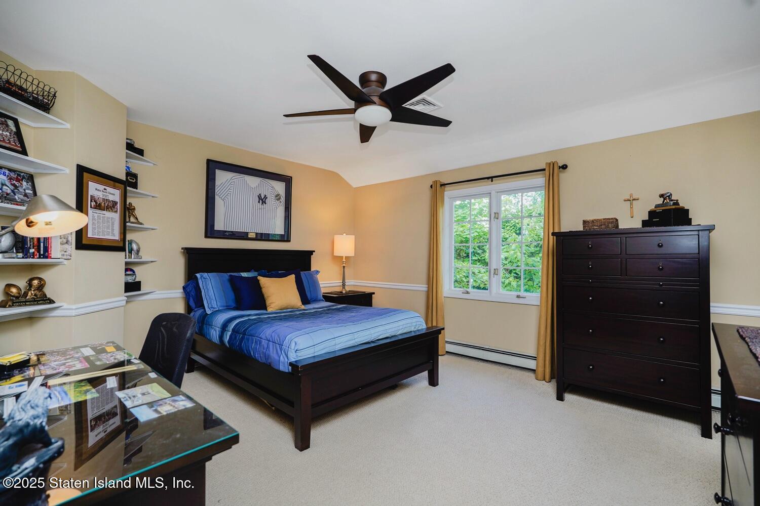 312 Barbara Street Staten Island, NY 10306 - Photo 22 of 34 a bedroom with a bed and a window