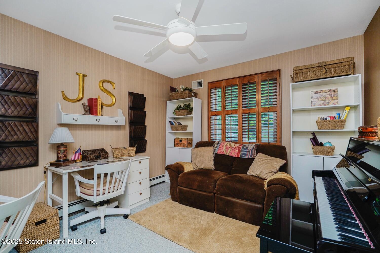 312 Barbara Street Staten Island, NY 10306 - Photo 24 of 34 a living room with furniture and a window