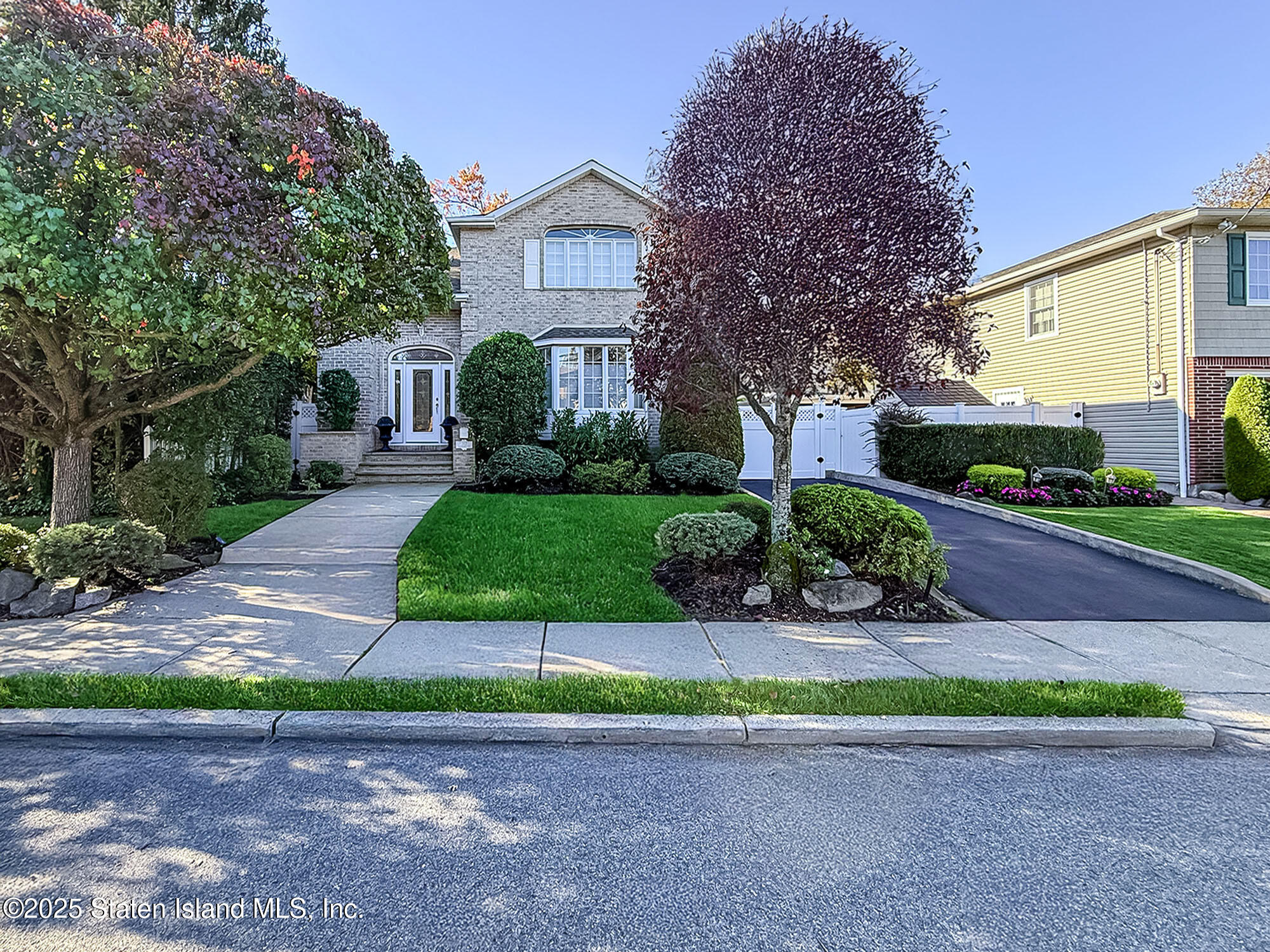 312 Barbara Street Staten Island, NY 10306 - Photo 3 of 34 a view of a house with a yard and plants