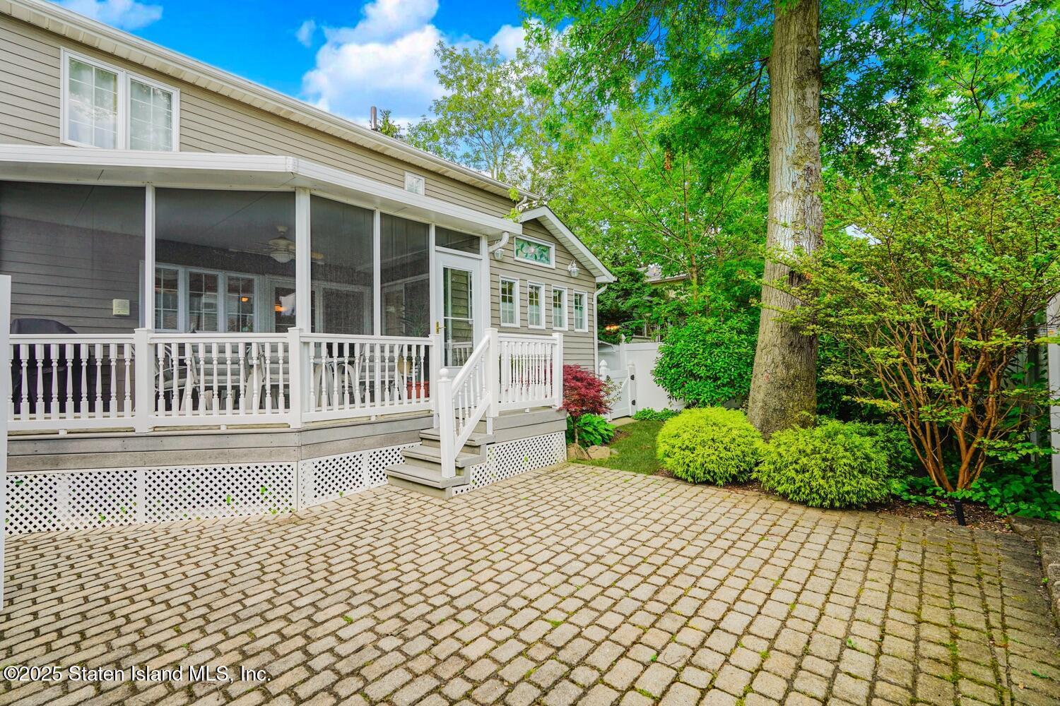 312 Barbara Street Staten Island, NY 10306 - Photo 33 of 34 a front view of a house with a garden and pathway