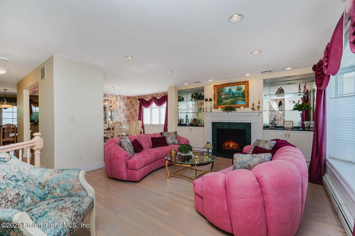 312 Barbara Street Staten Island, NY 10306 - Photo 6 of 34 a living room with furniture and a fireplace