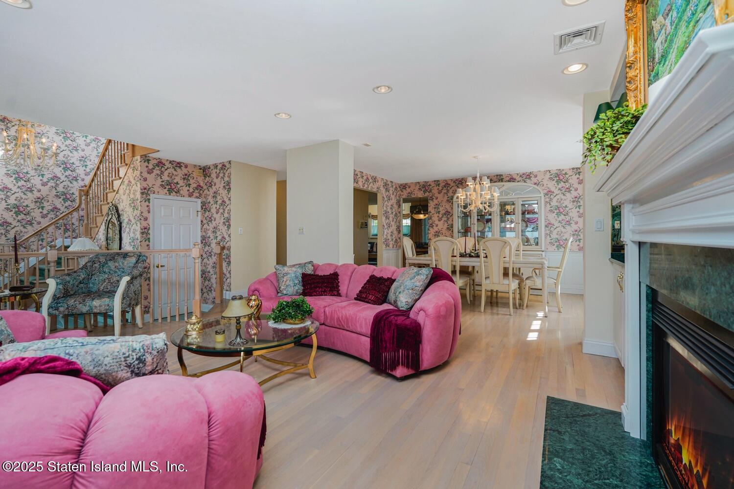 312 Barbara Street Staten Island, NY 10306 - Photo 7 of 34 a living room with furniture fireplace and a potted plant