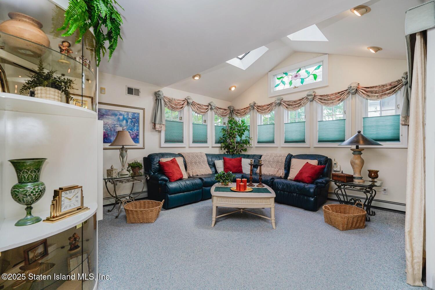 312 Barbara Street Staten Island, NY 10306 - Photo 8 of 34 a living room with furniture and a potted plant