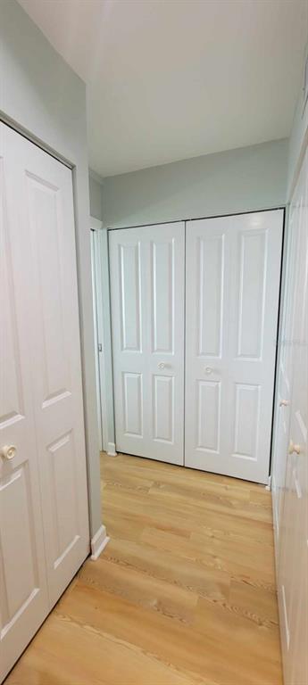 632 Edgewater Drive, Unit 537 Dunedin, FL 34698 - Photo 23 of 28 a view of wooden floor and brick wall