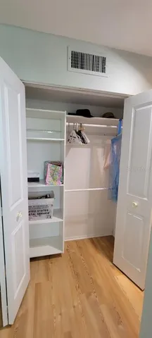 a front view of a building with a lake view