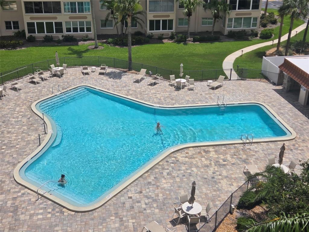 632 Edgewater Drive, Unit 537 Dunedin, FL 34698 - Photo 27 of 28 a view of a backyard with plants and patio