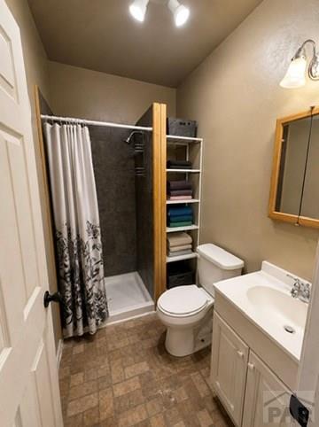 11229 County Rd JJ 5 Manzanola, CO 81058 - Photo 20 of 32 a bathroom with a sink toilet and shower
