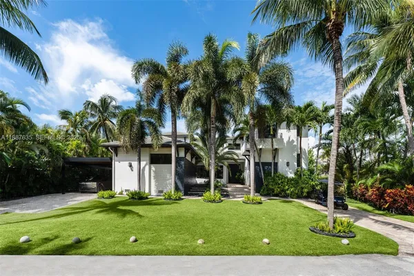 a front view of house with yard and green space