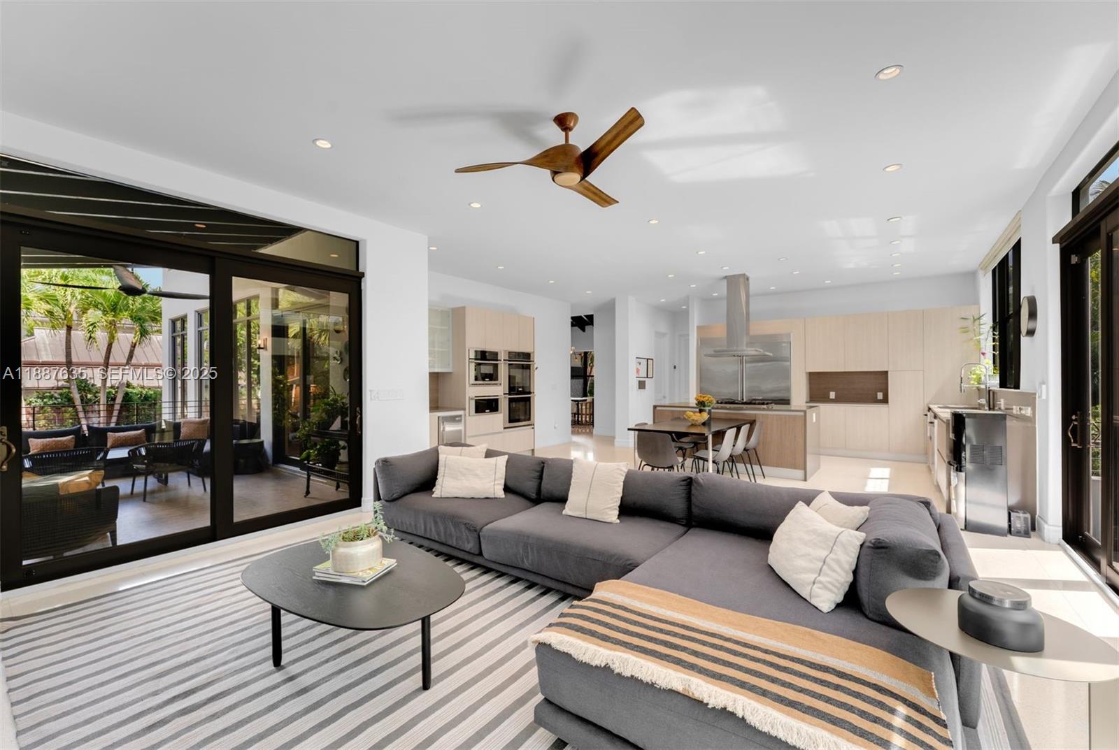 330 Caribbean Road Key Biscayne, FL 33149 - Photo 14 of 46 a bedroom with furniture and a large window