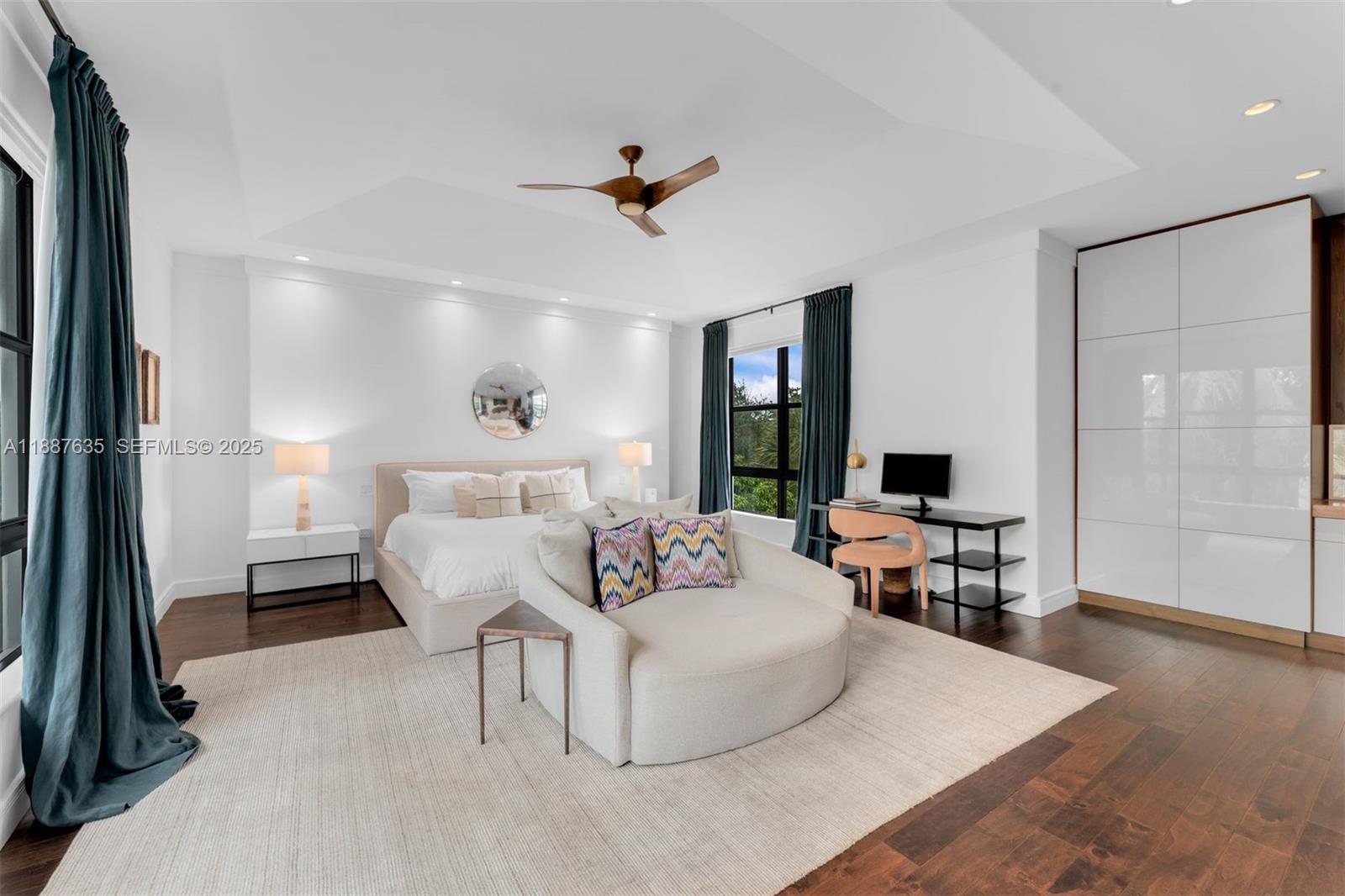 330 Caribbean Road Key Biscayne, FL 33149 - Photo 20 of 46 a living room with furniture and a flat screen tv