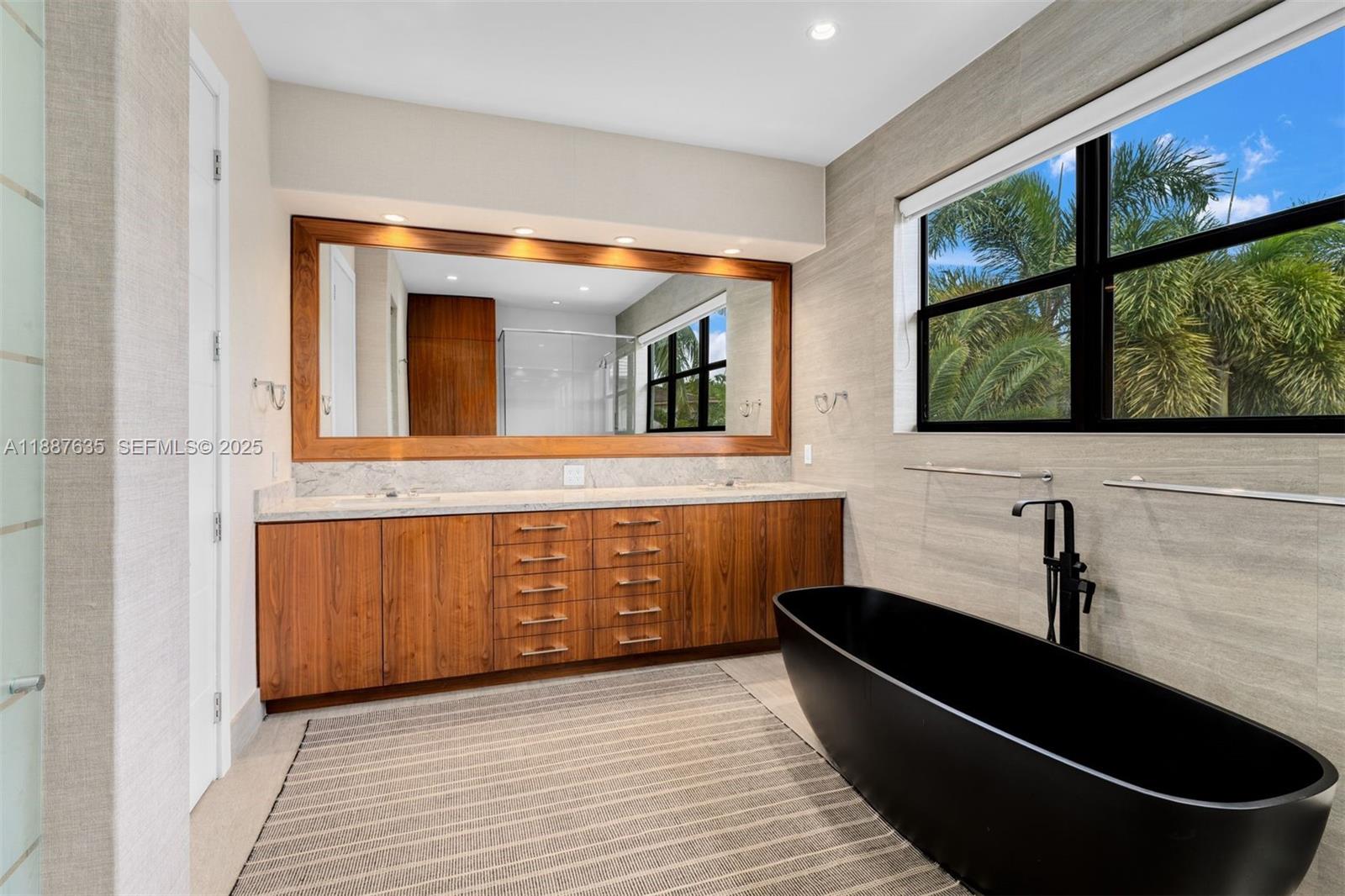 330 Caribbean Road Key Biscayne, FL 33149 - Photo 22 of 46 a living room with stainless steel appliances granite countertop a sink and a wooden floor