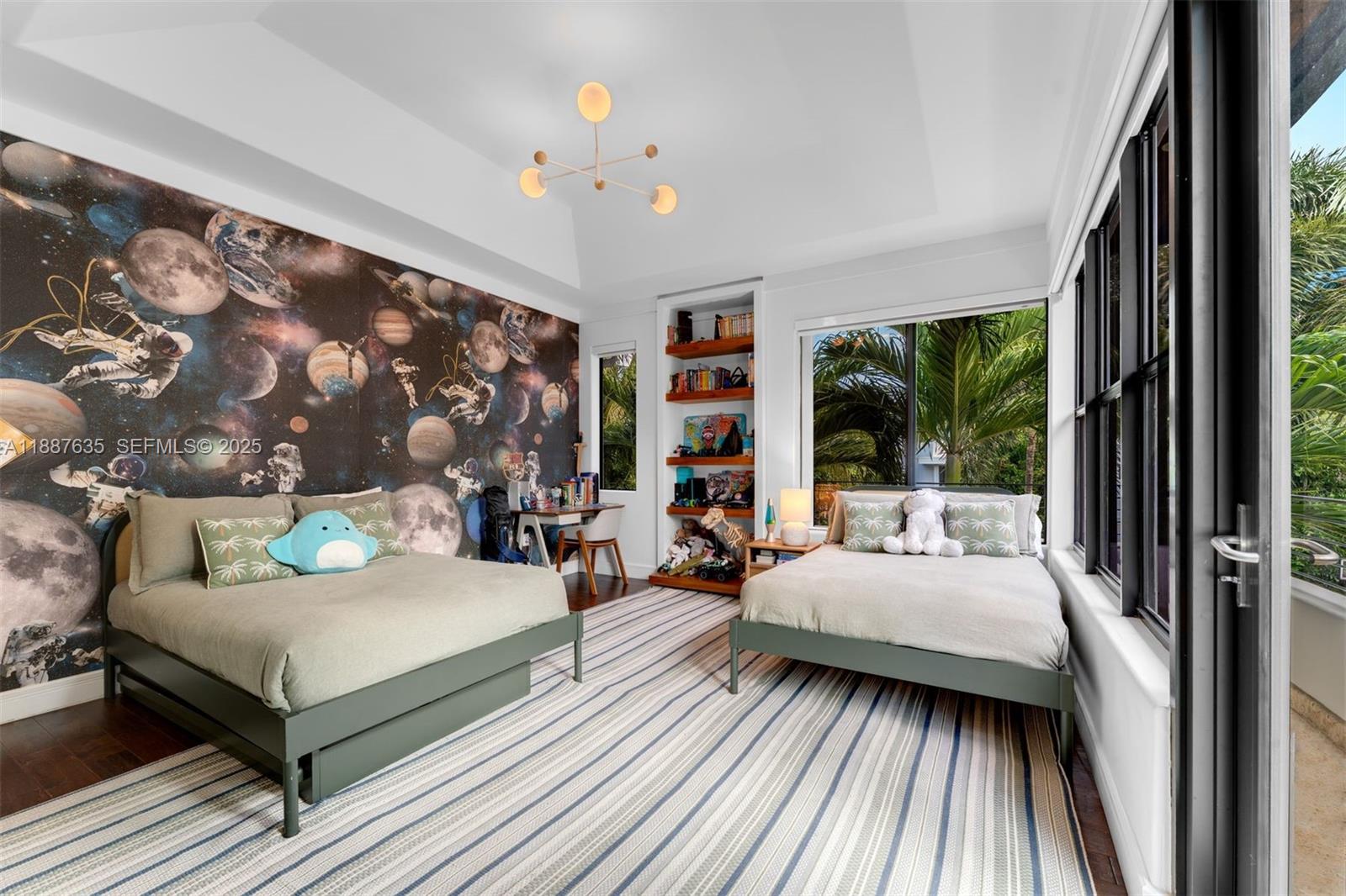330 Caribbean Road Key Biscayne, FL 33149 - Photo 25 of 46 a bedroom with a bed and a couch next to a window