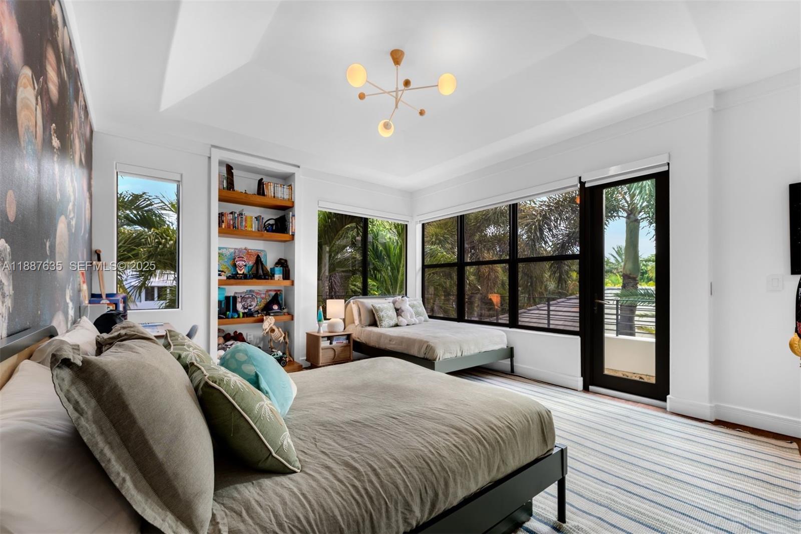 330 Caribbean Road Key Biscayne, FL 33149 - Photo 26 of 46 a bedroom with a large bed and a large window
